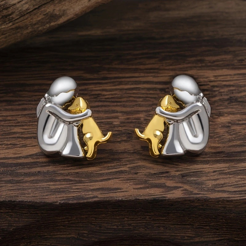 Petite Fille Câlinant un Chien – Clous d’Oreilles et Collier