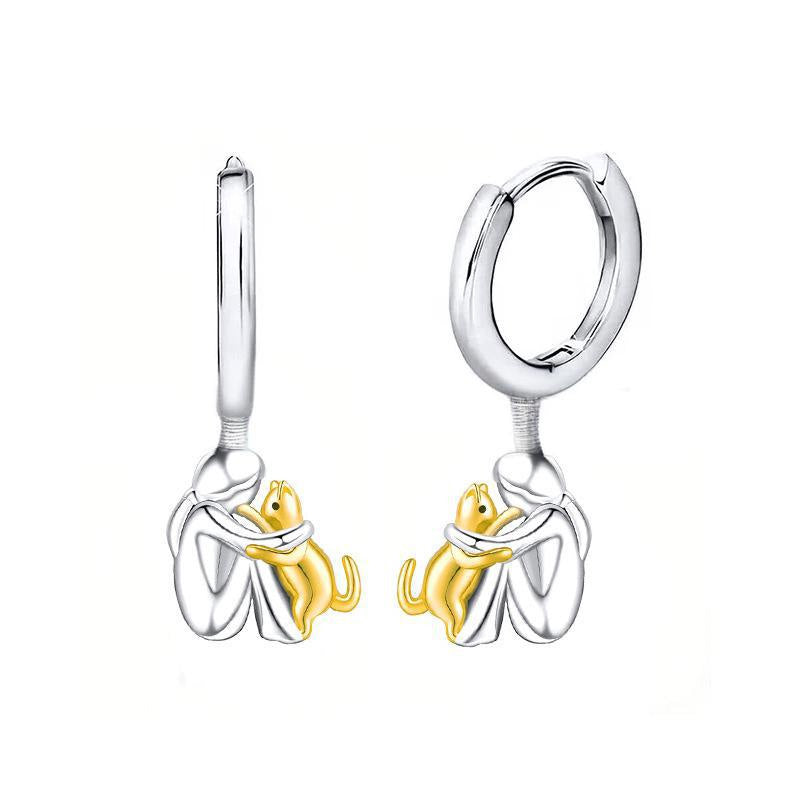 Petite Fille Câlinant un Chien – Clous d’Oreilles et Collier