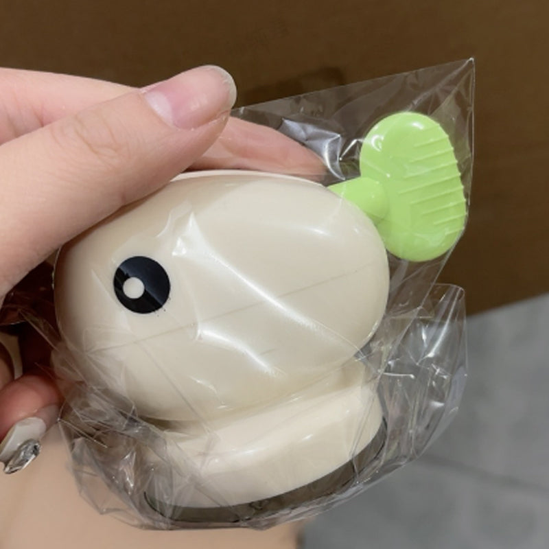 Adorable poisson rouge avec ventouse pour presser le dentifrice